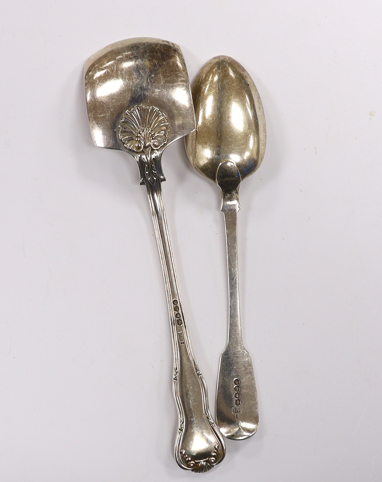 A William IV silver shell pattern server by Mary Chawner, London, 1835 and a similar fiddle pattern table spoon, London, 1834, 7.8oz.